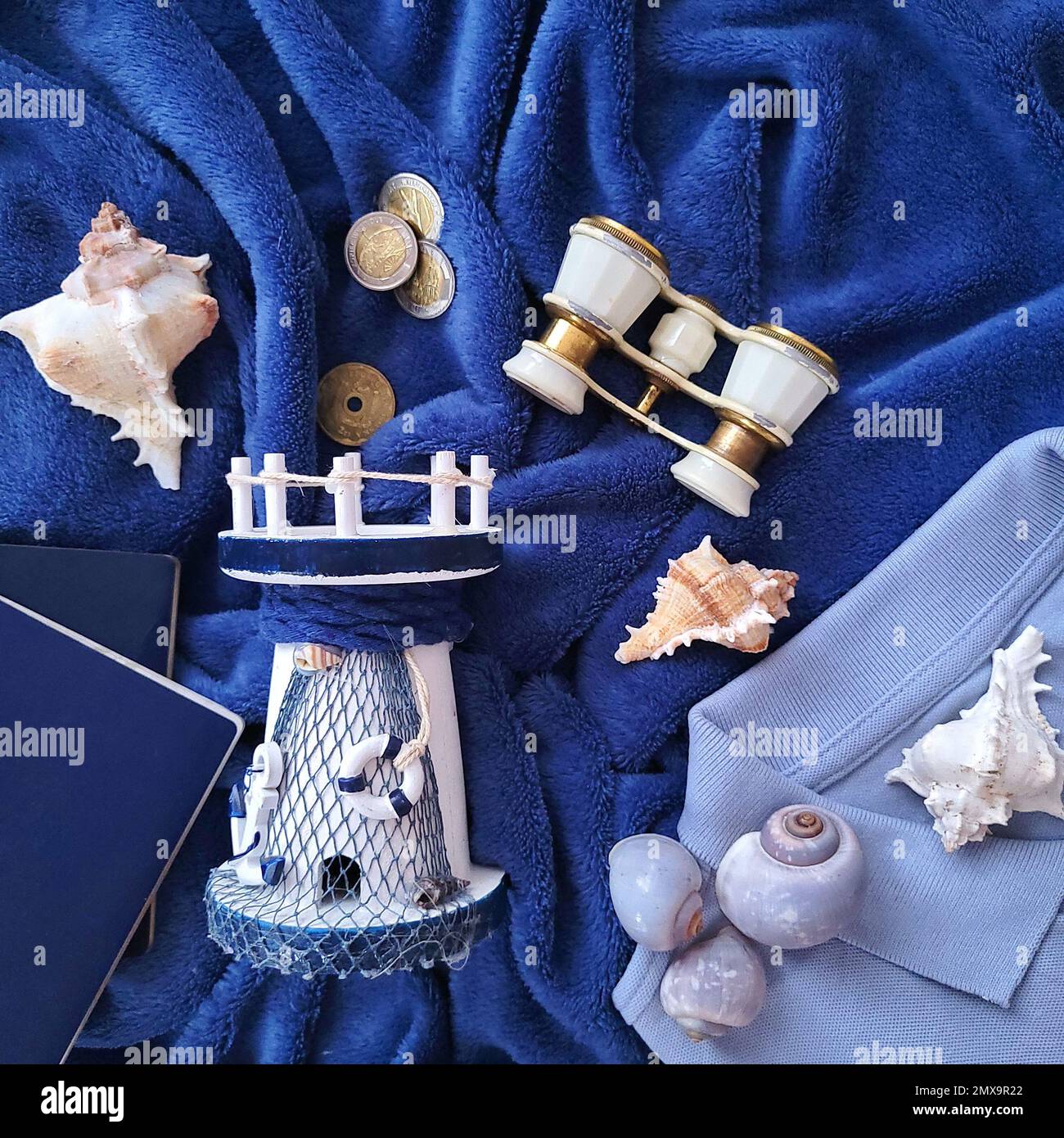 On A Blue Background A Passport Polo And Souvenirs Collected On A on-a-blue-background-a-passport-polo-and-souvenirs-collected-on-a