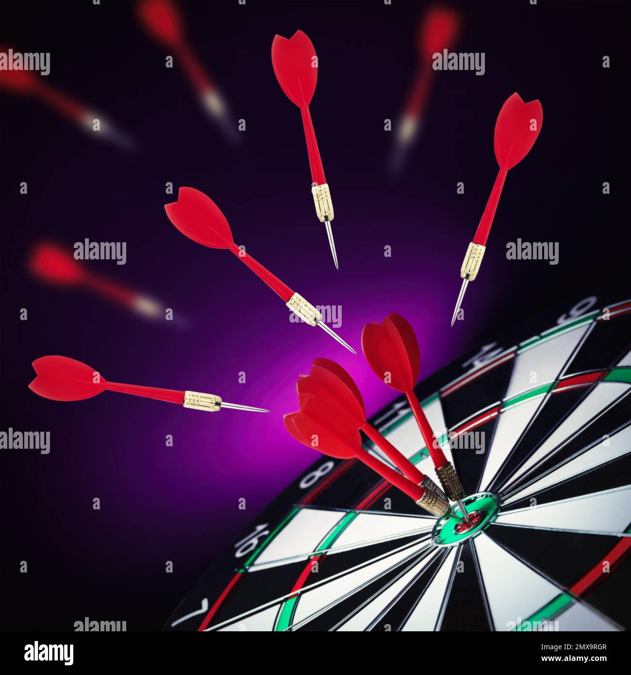 Board and darts on dark violet background Stock Photo Alamy