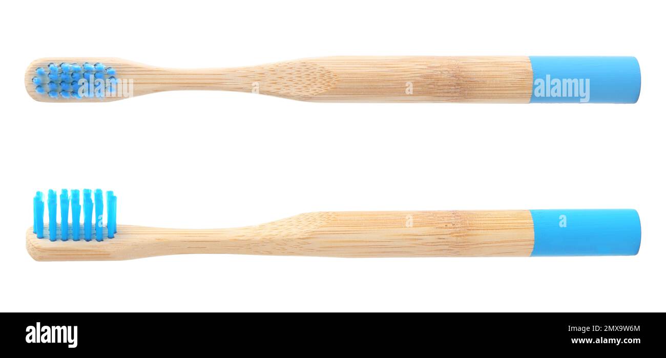 Bamboo toothbrushes with blue bristles on white background Stock Photo