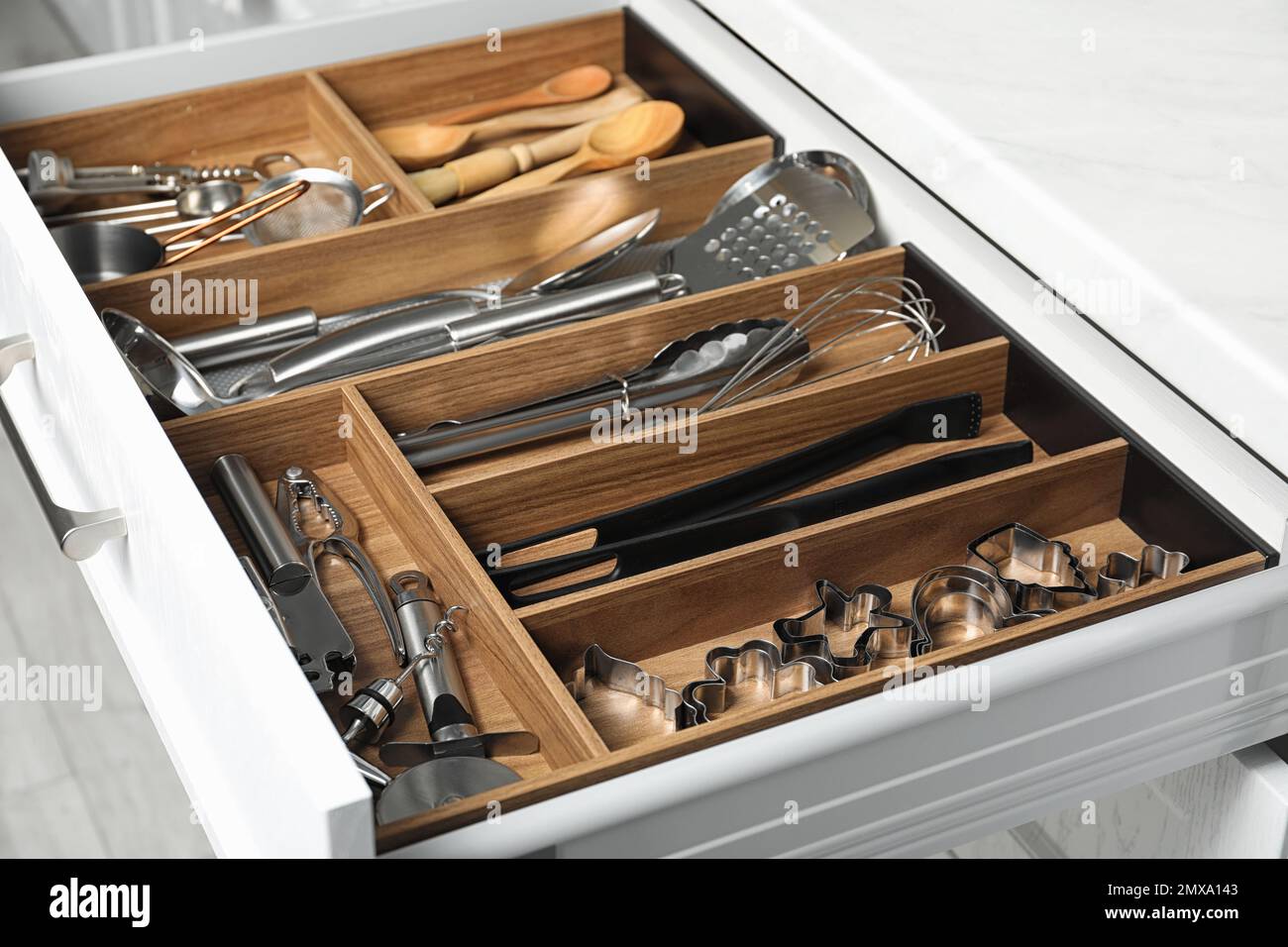 Different utensils in open desk drawer indoors Stock Photo Alamy