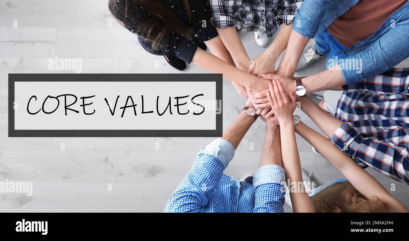 Core values concept. People holding hands together, top view Stock