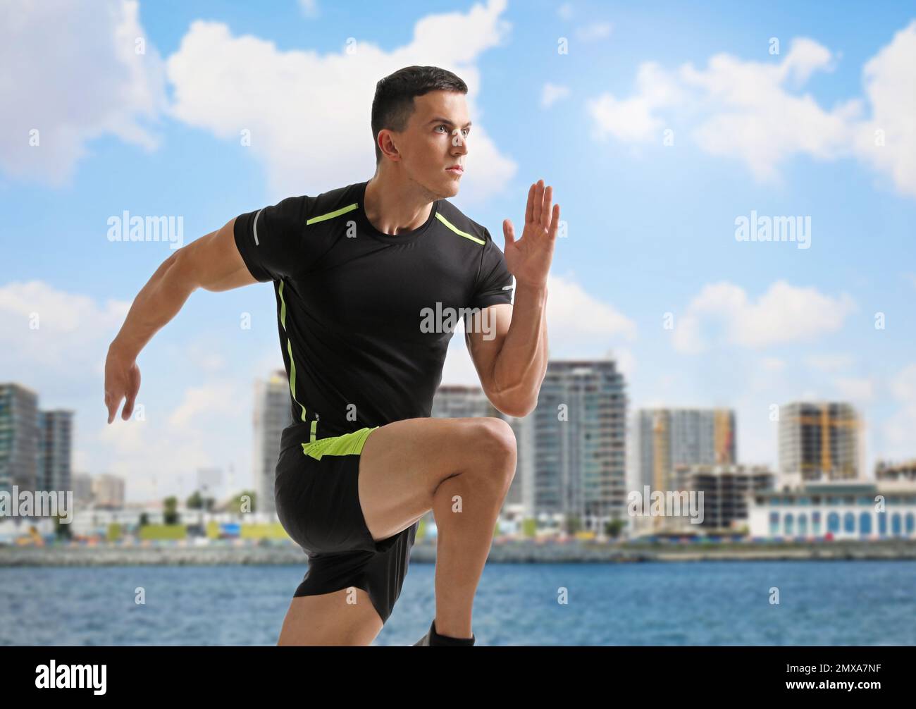 Young man running at riverside hi-res stock photography and images - Alamy