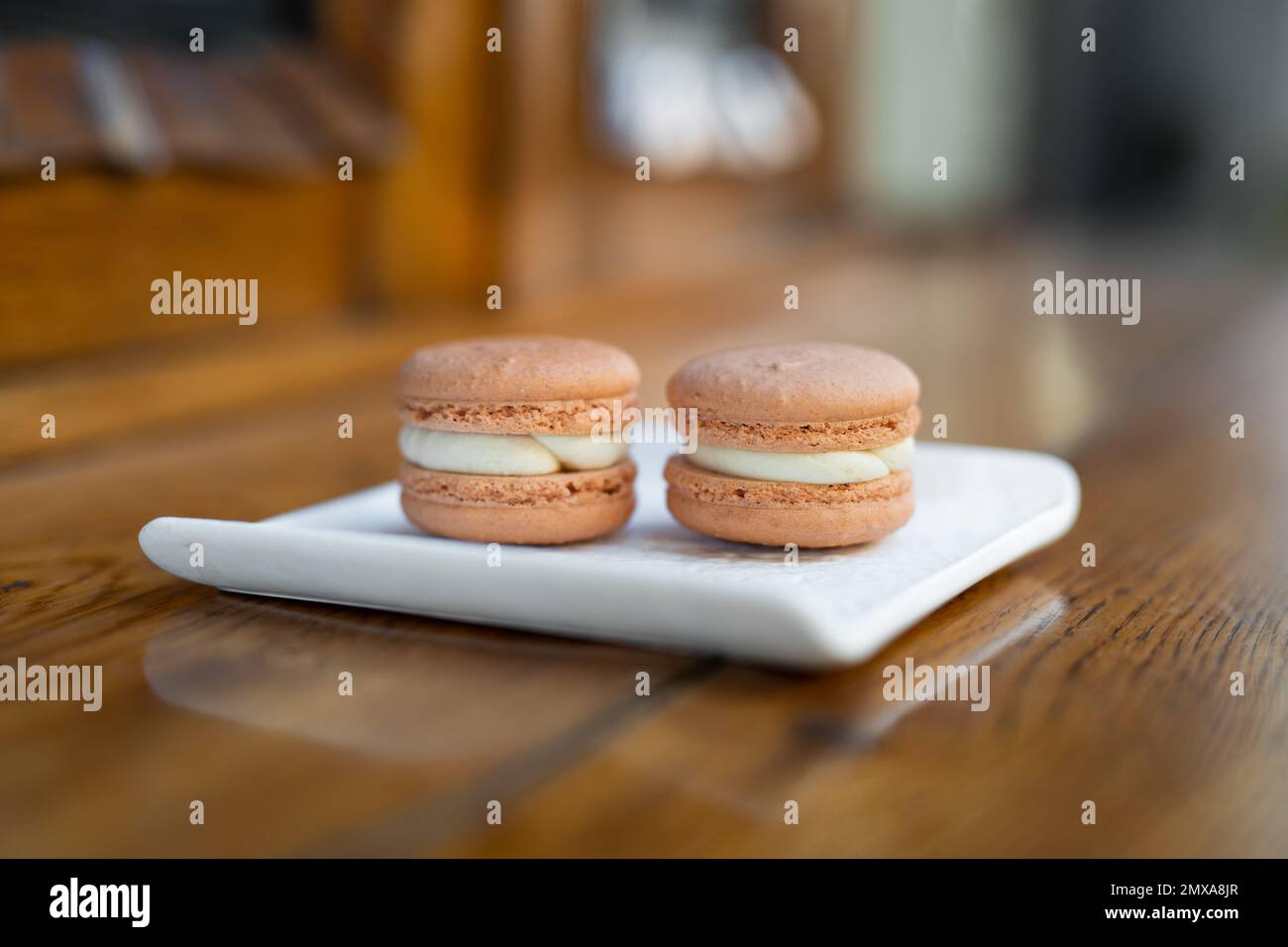 various delicious macaron cookies on a square plate stand Stock Photo