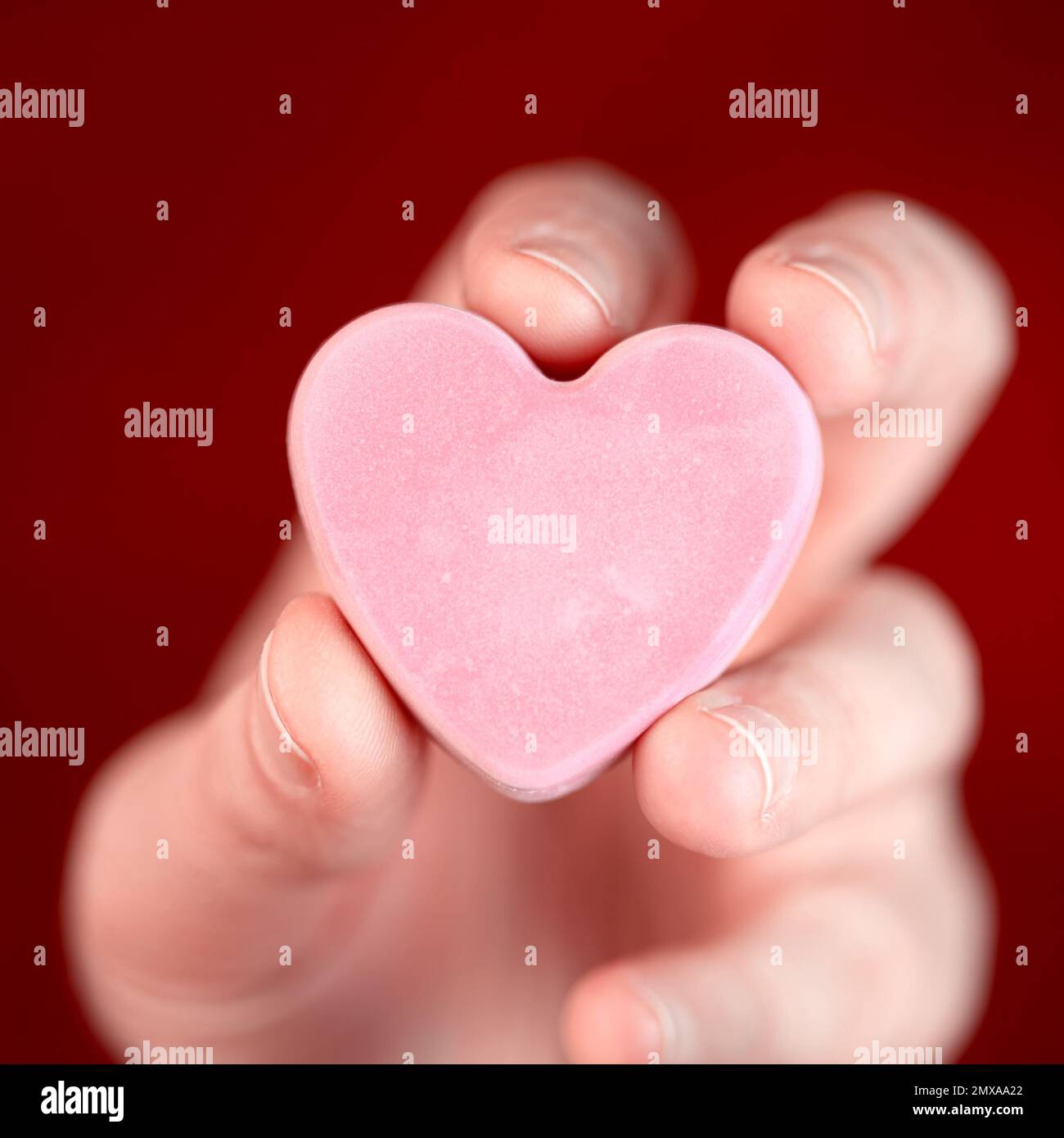 Hand holding blank converstation heart Stock Photo