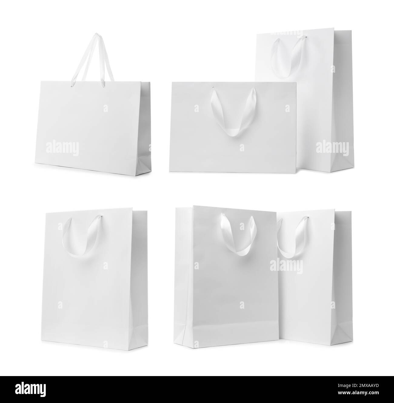 Set with paper shopping bags on white background Stock Photo Alamy