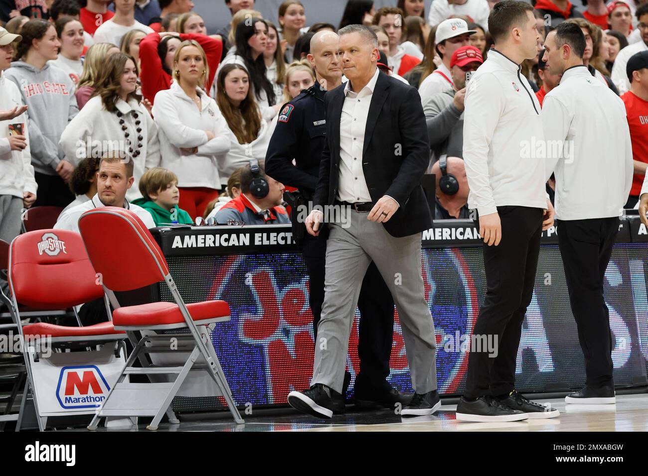 Ohio State head coach Chris Holtmann, center, leaves the court after