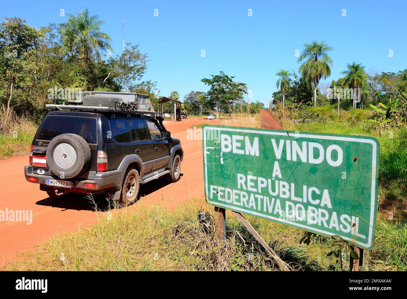 Offroad vehicle, Toyota Land Cruiser at the sign to Brazil at the border with Bolivia