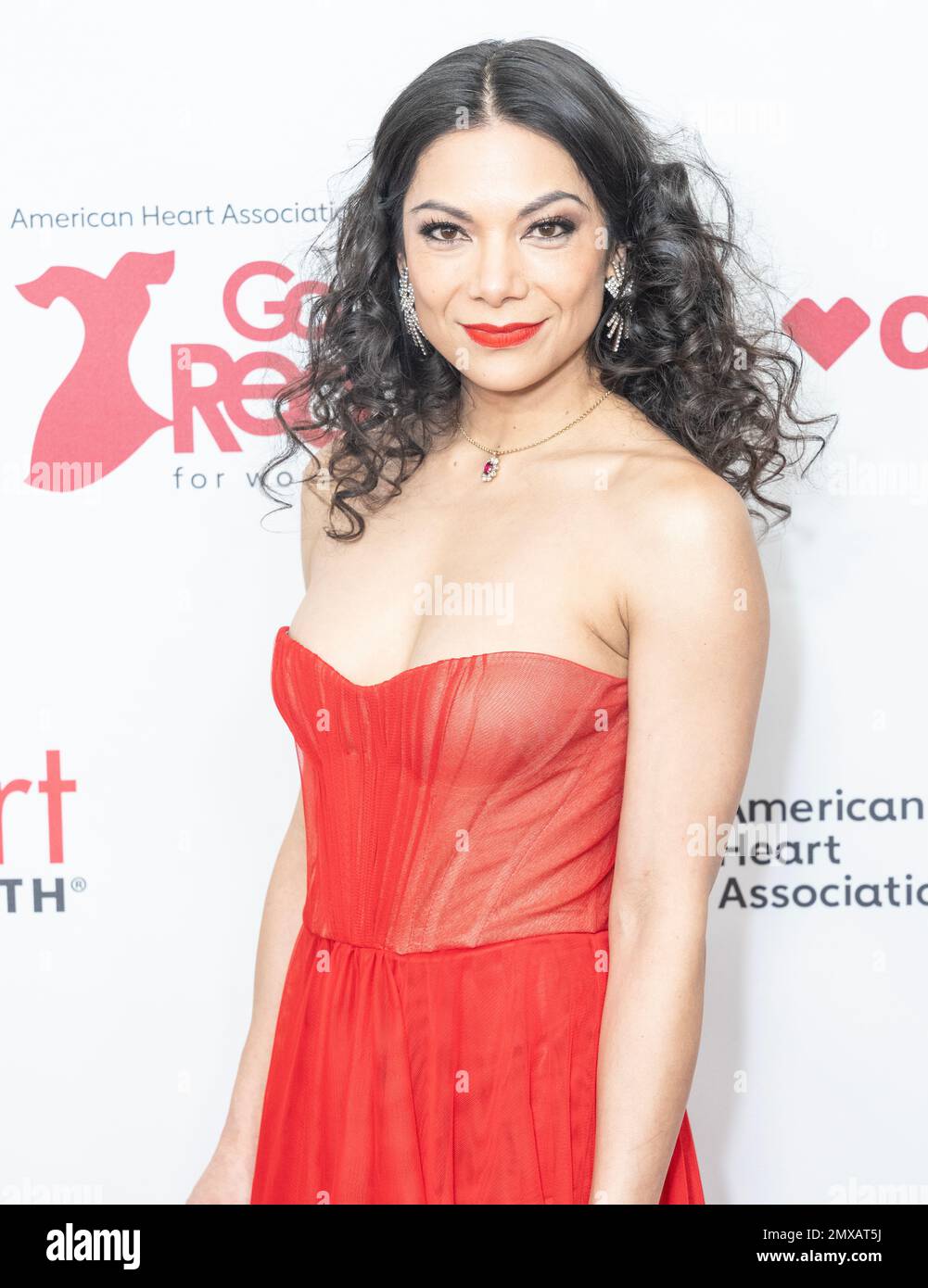 Ginger Gonzaga wearing dress by Gustavo Cadilo attends American Heart Association’s Go Red for