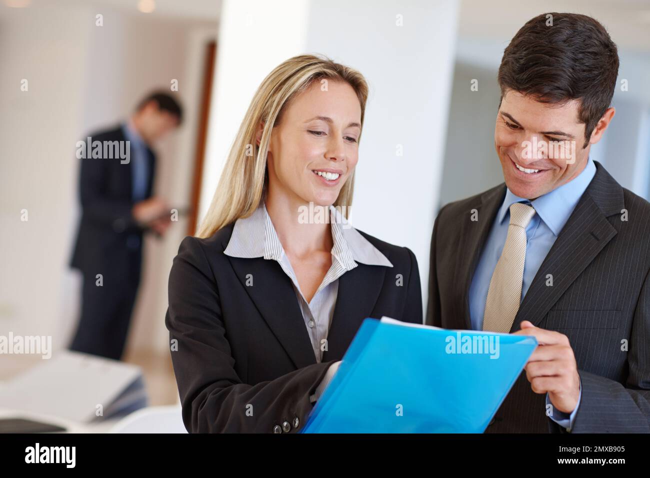 Effective collaboration in business. two business professionals discussing a document. Stock Photo