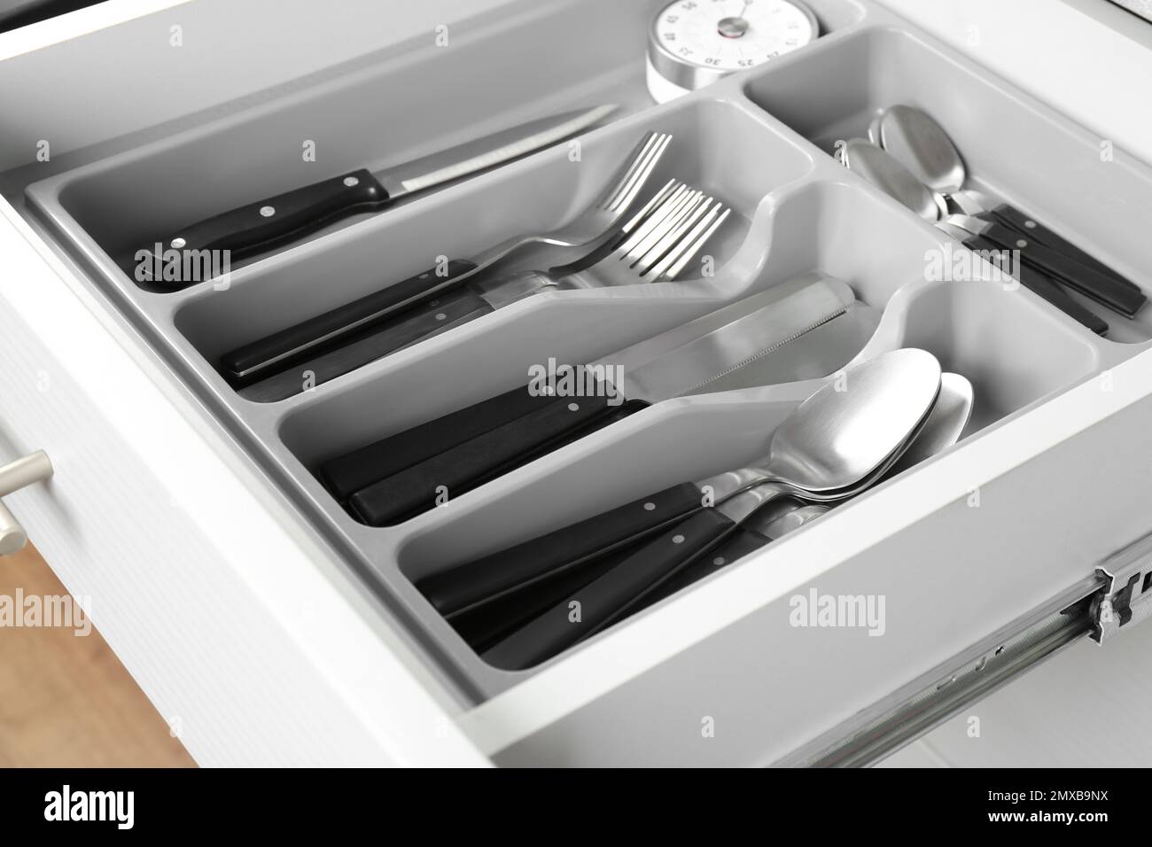 Open drawer with different utensils. Order in kitchen Stock Photo Alamy