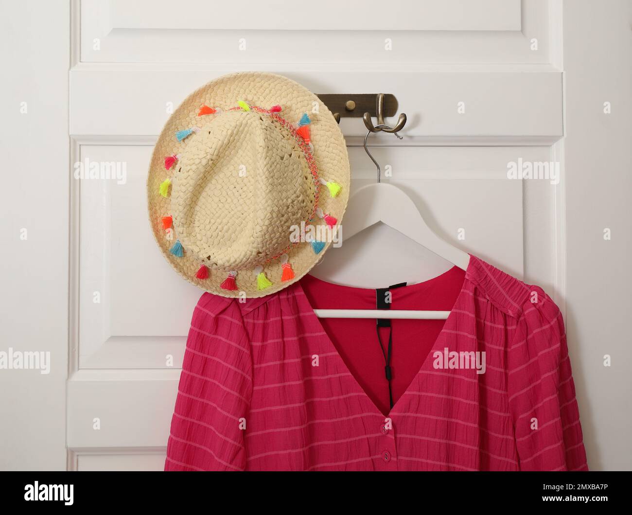 Clothing hanging on hooks hi-res stock photography and images - Alamy