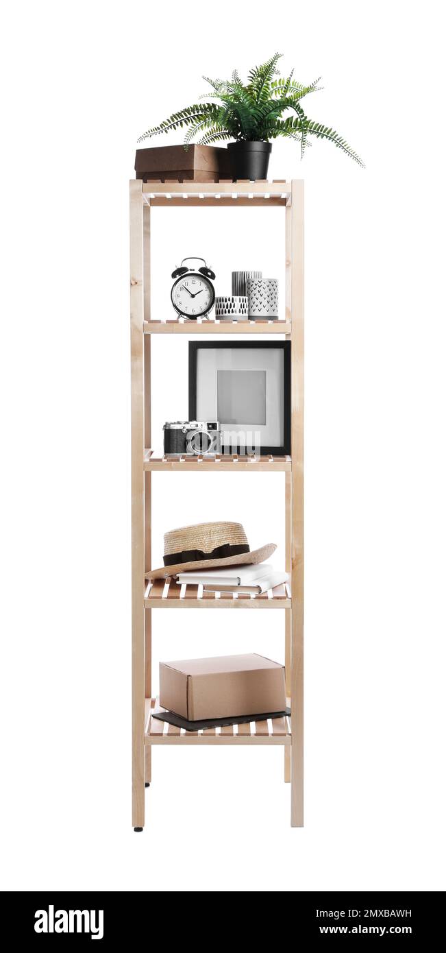 Wooden shelving unit with different items isolated on white Stock Photo