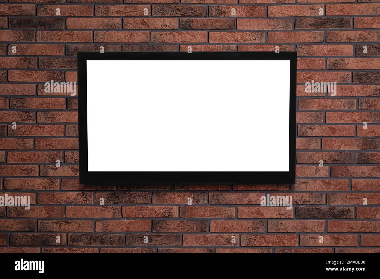 Modern TV on brick wall. Space for design Stock Photo Alamy