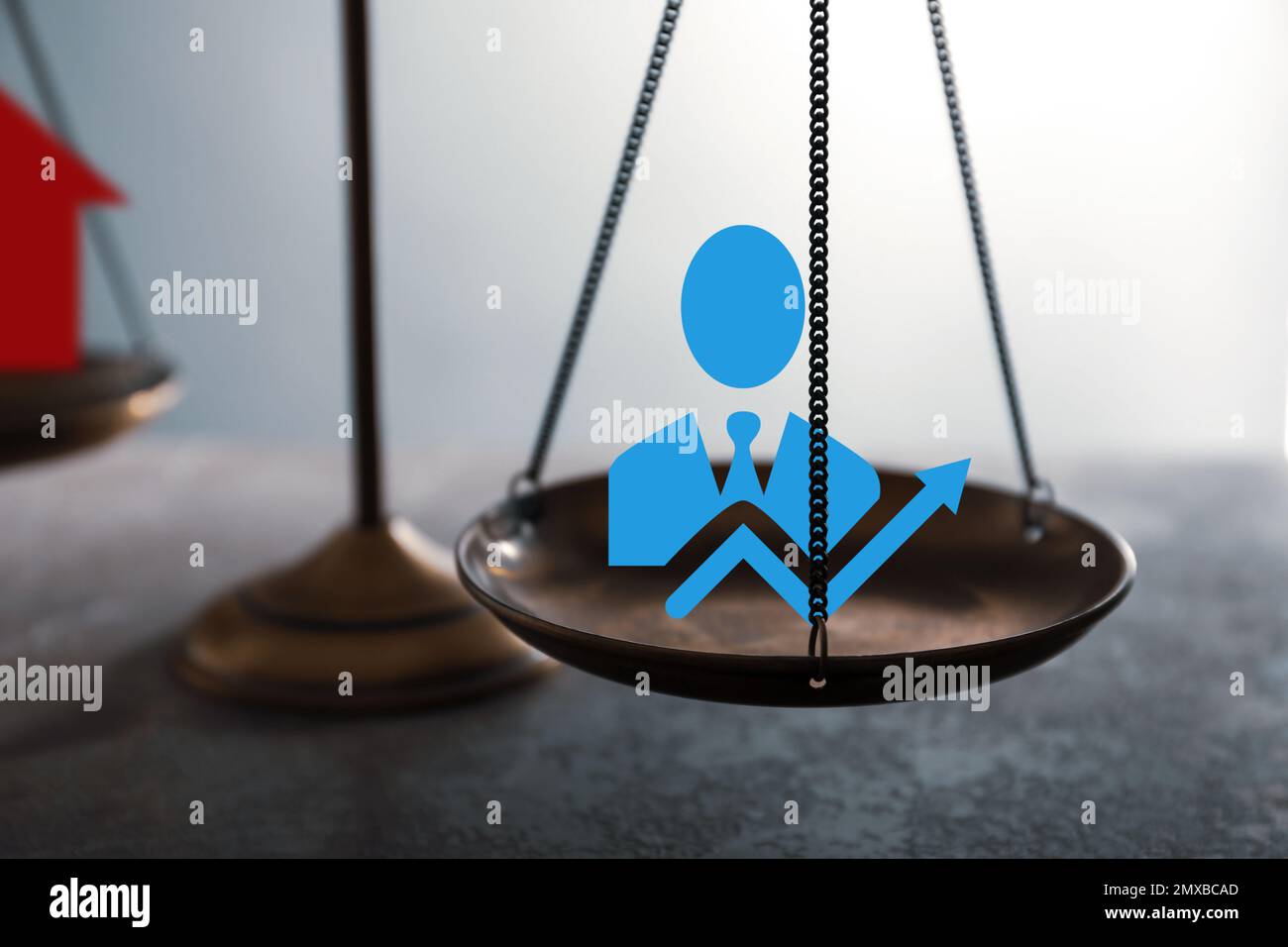 Work-life balance concept. Scale with images on table, closeup Stock ...