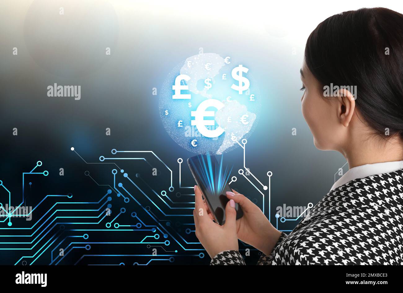 Fintech concept. Young woman with smartphone and world globe on grey ...