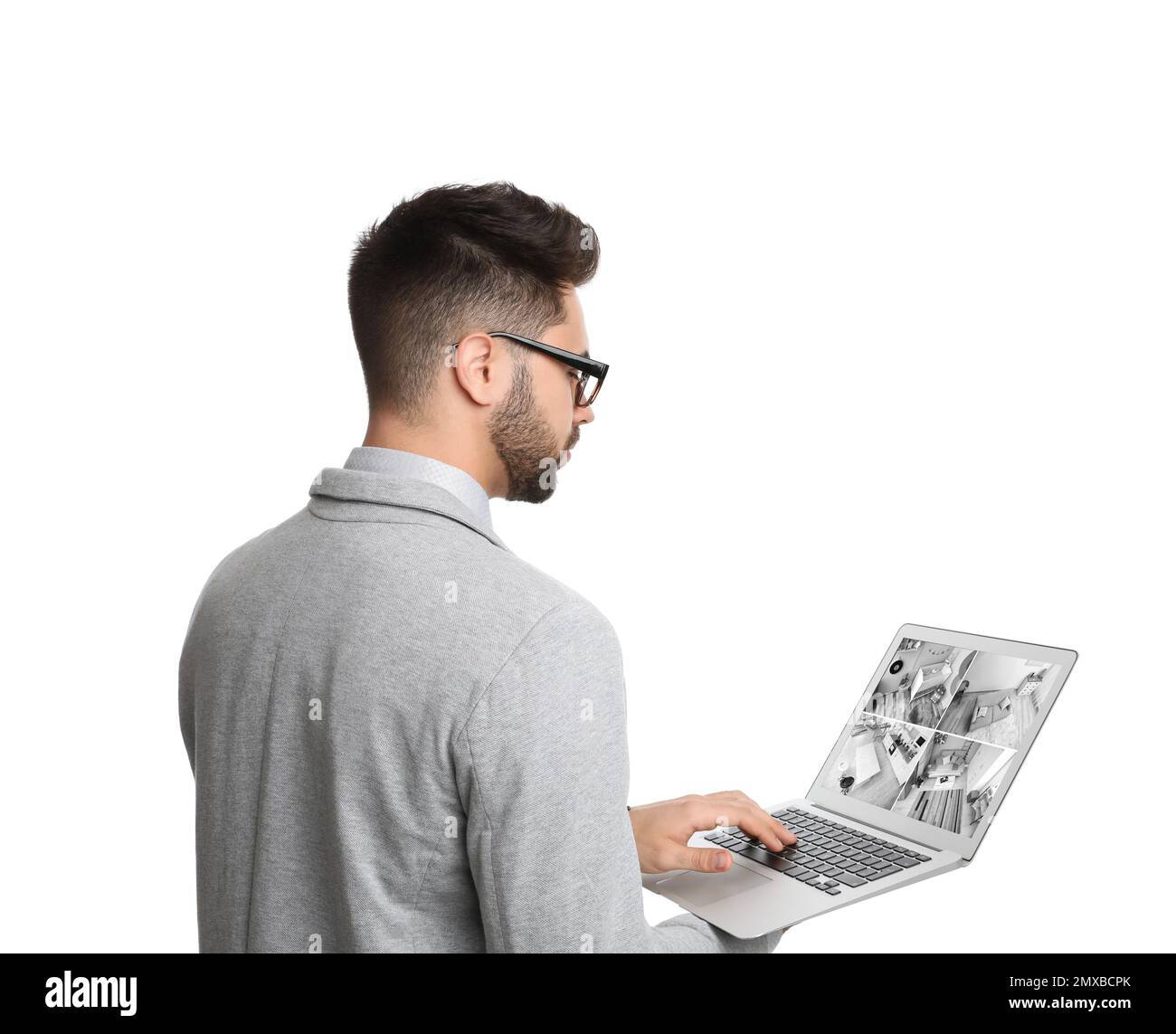 Man monitoring modern cctv cameras on laptop. Home security system