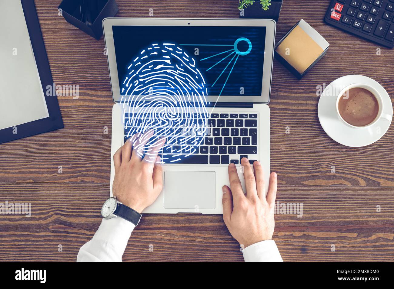 Fingerprint identification. Man working with laptop at table, top view ...