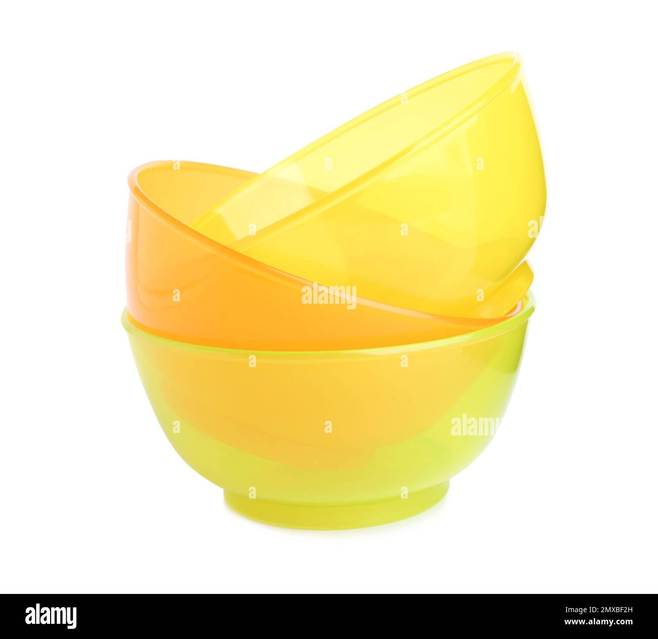 Stack of plastic bowls isolated on white. Serving baby food Stock Photo