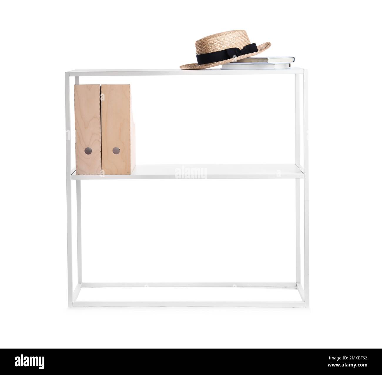 Stylish shelving unit with hat, books and folders on white Stock Photo