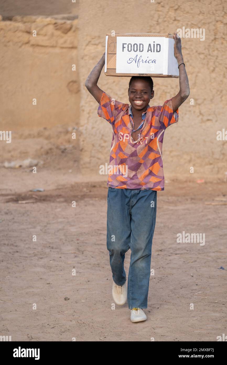 Food aid during Ramadan in Africa. iftar treat and happy people Stock
