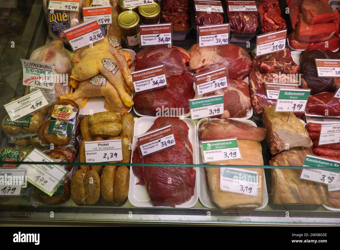 Berlin, Germany. 27th Jan, 2023. Numerous types of game meat are on display at the Wild & Geflügel Albrecht butcher shop on Acacia Street. The prices for venison and wild boar have recently risen sharply, but venison is in demand. (to dpa 'Saddle of venison and leg of wild boar: coveted, but rare') Credit: Joerg Carstensen/dpa/Alamy Live News Stock Photo