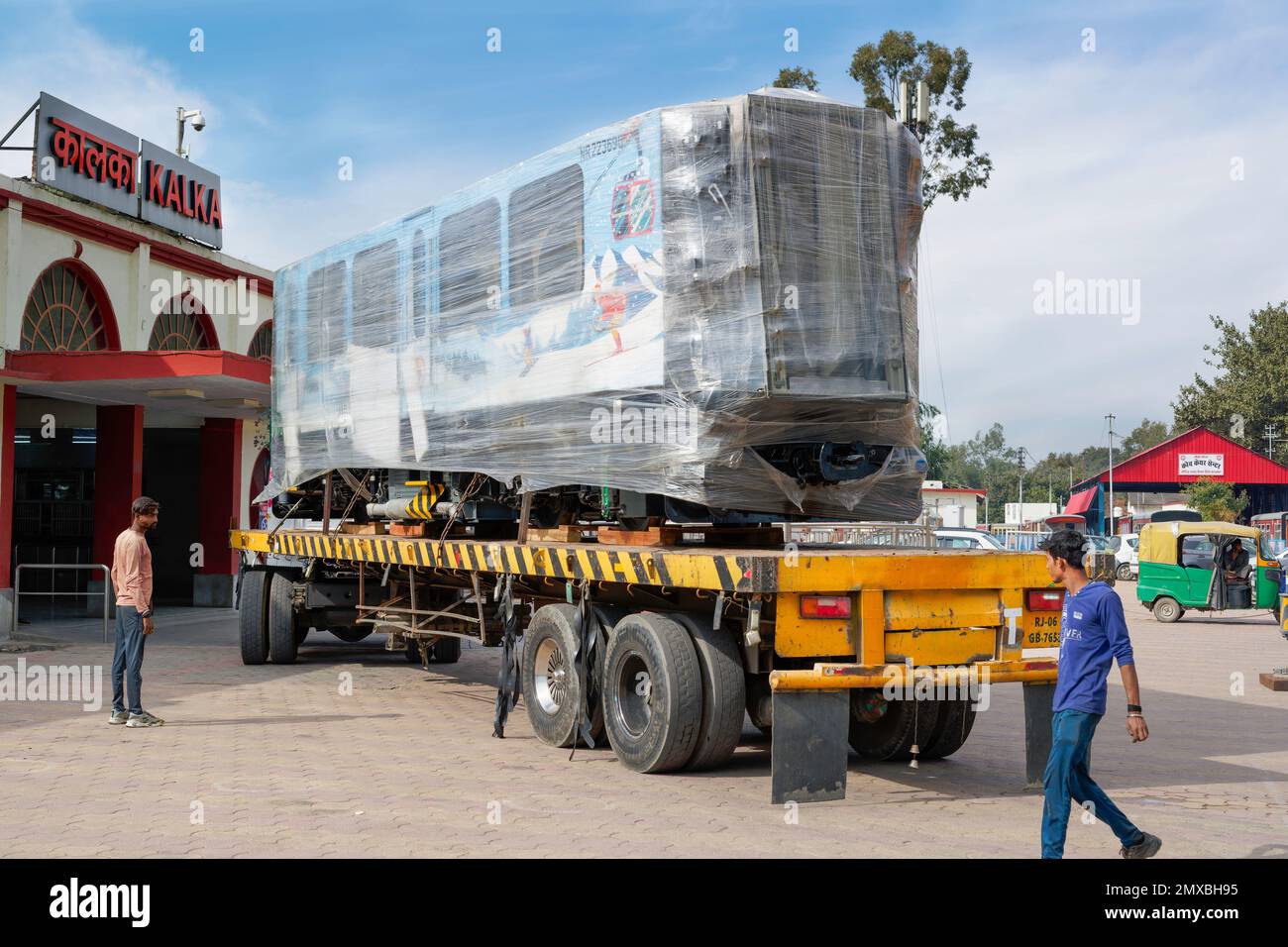 (Latest - News) New DHMU train Kalka to Shimla, Getting ready to be offloaded on tracks at Kalka (Haryana), India. Stock Photo