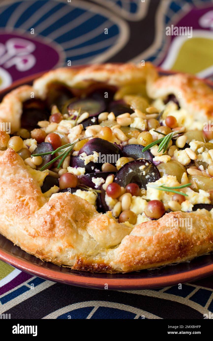 homemade grape tart with cottage cheese,pine nut and rosemary Stock