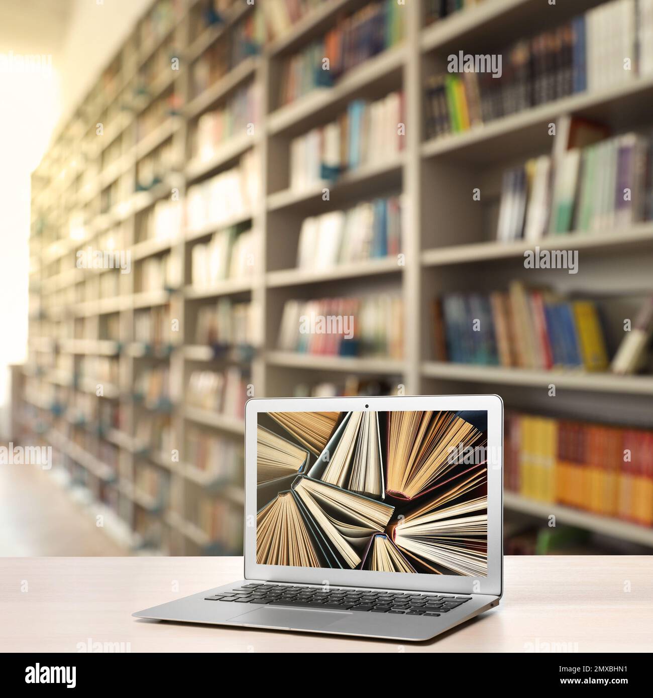 Digital library concept. Modern laptop on table indoors Stock Photo - Alamy