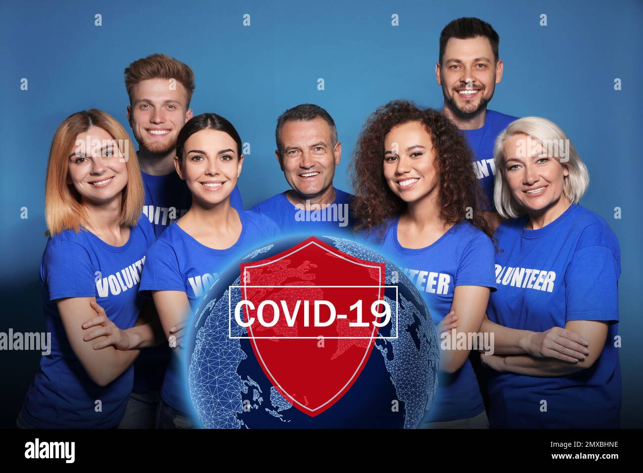 Volunteers uniting to help during COVID-19 outbreak. Group of people on blue background, world globe and shield illustrations Stock Photo