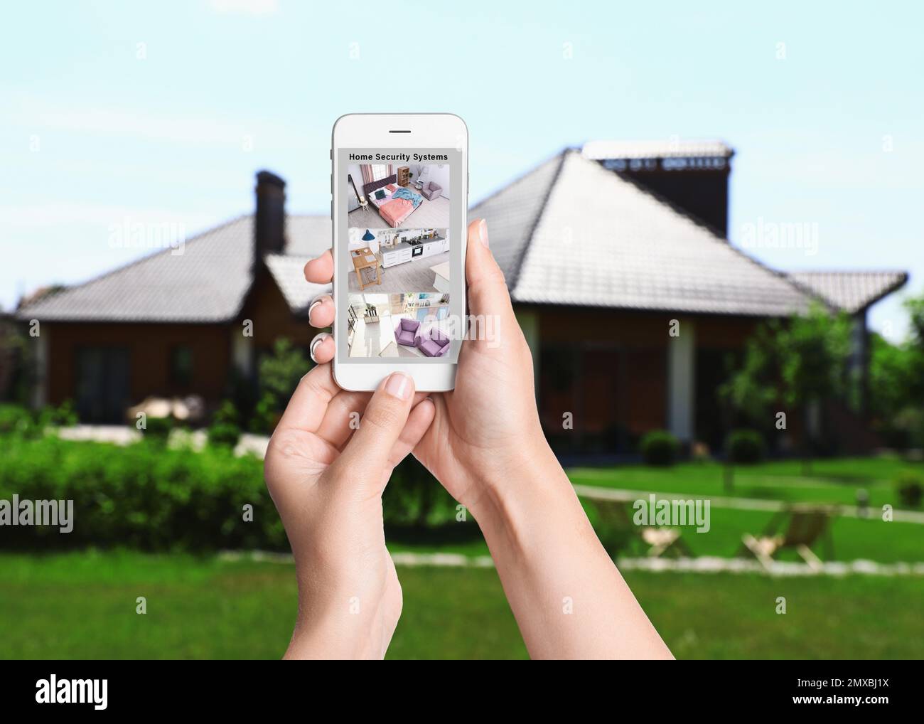 Alarm system. Woman monitoring modern CCTV cameras on smartphone ...