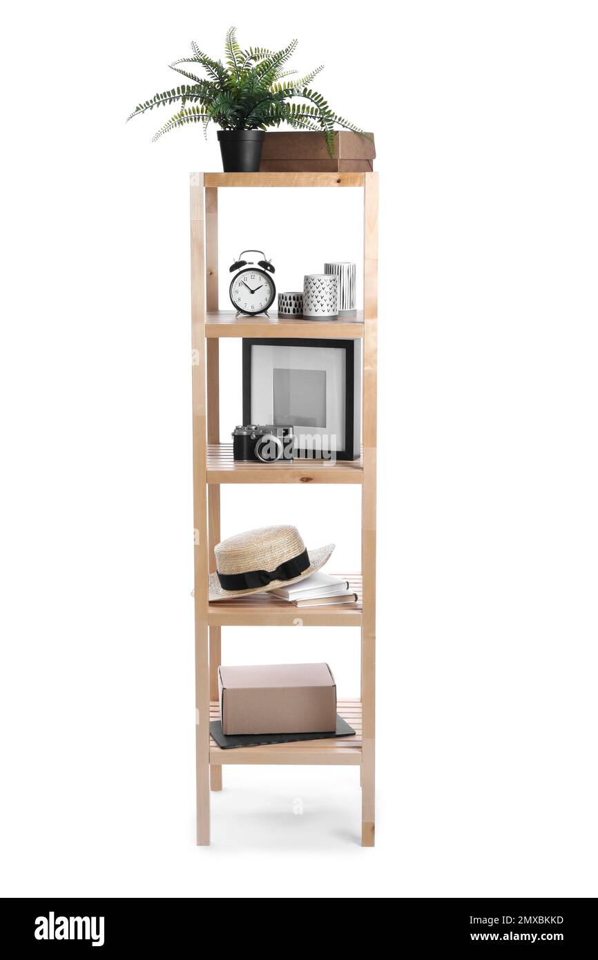 Wooden shelving unit with different items isolated on white Stock Photo