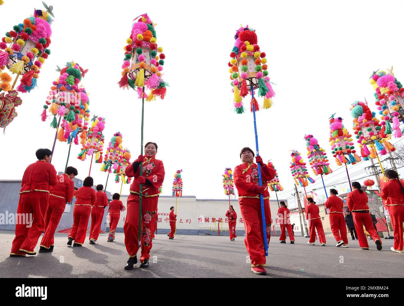 HANDAN, CHINA - FEBRUARY 3, 2023 - Villagers perform the intangible cultural heritage "Weizi Lantern Array" to celebrate the Lantern Festival in Handa Stock Photo