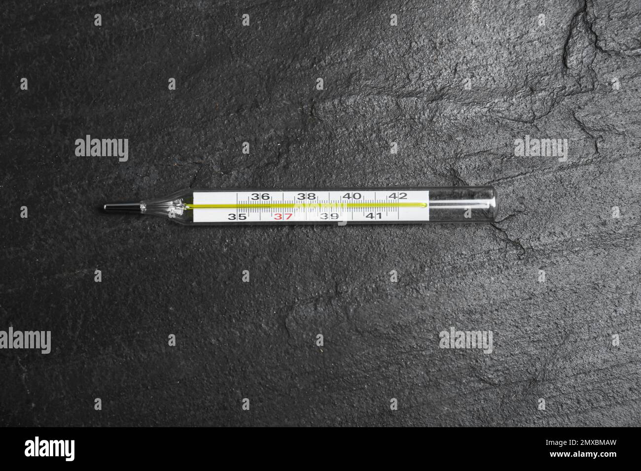 Mercury thermometer on black slate background, top view Stock Photo - Alamy