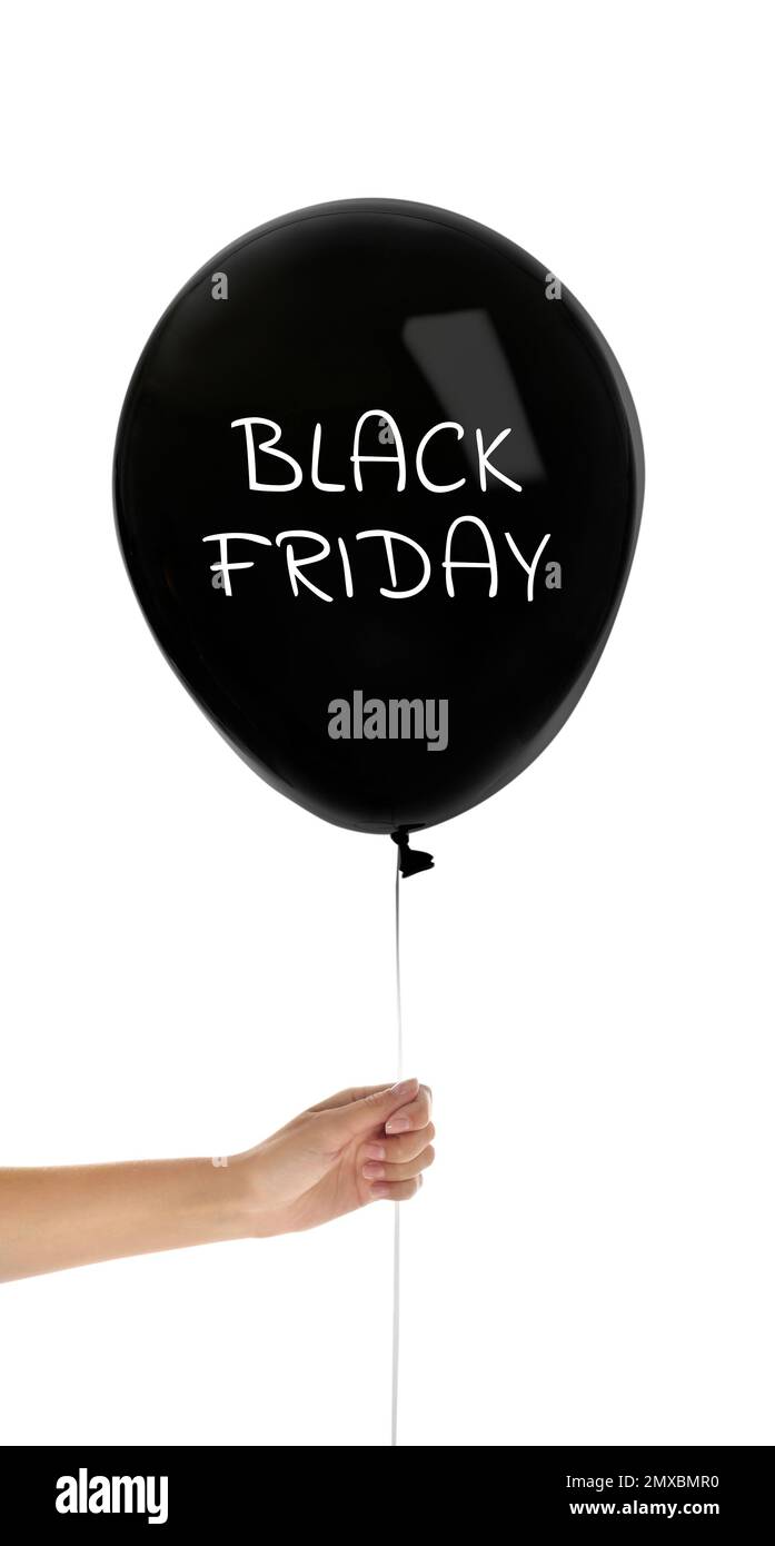 Woman holding balloon with text BLACK FRIDAY on white background, closeup Stock Photo