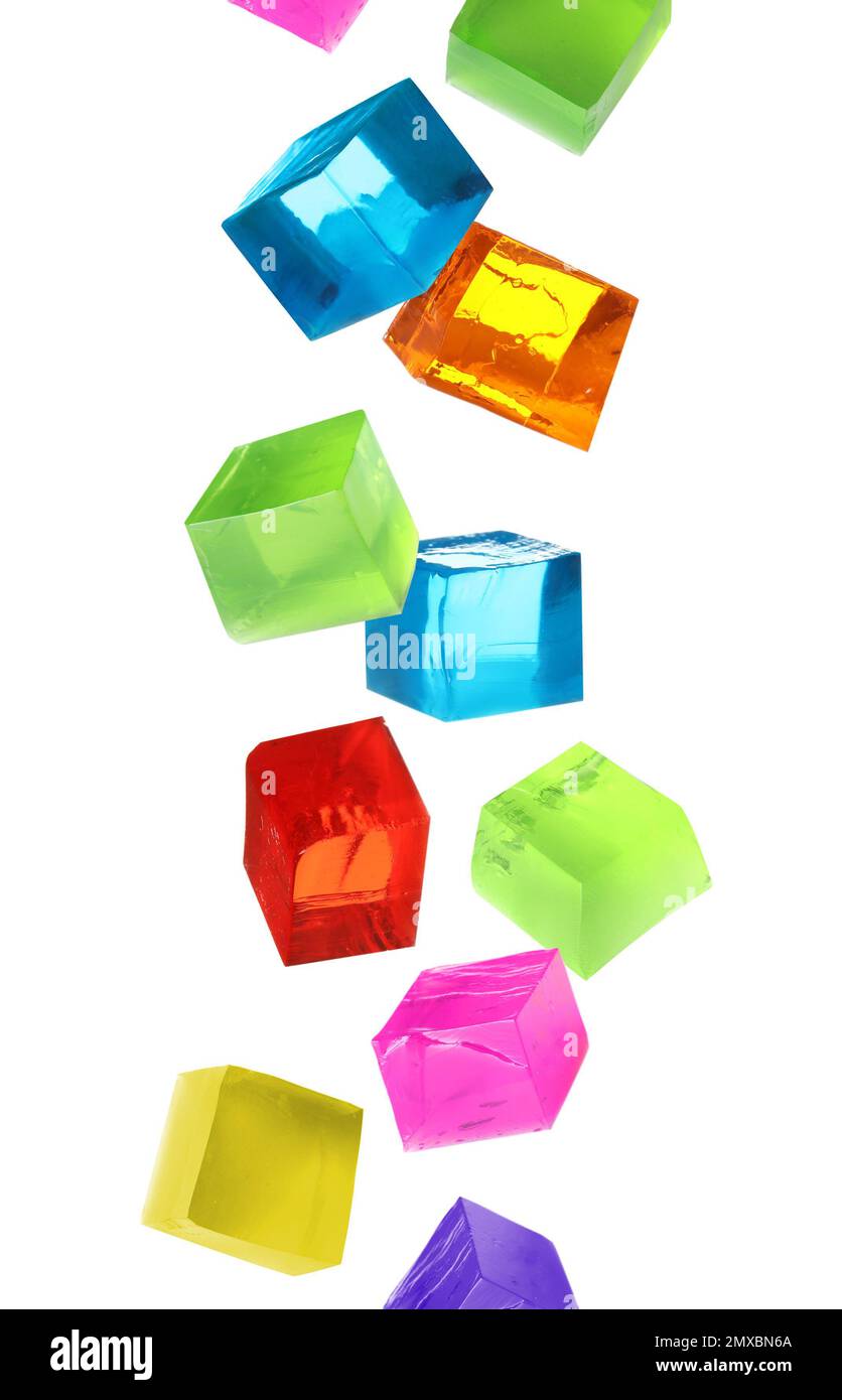 Set of different delicious jelly cubes falling on white background Stock Photo Alamy