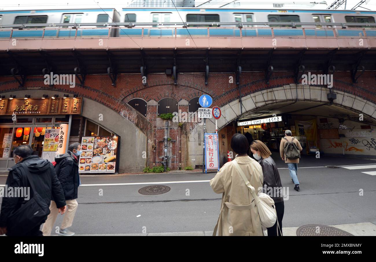 Izakayas and bars are found under the JR line elevated track between Yuracucho st. and Shimbashi st. in Tokyo, Japan. Stock Photo