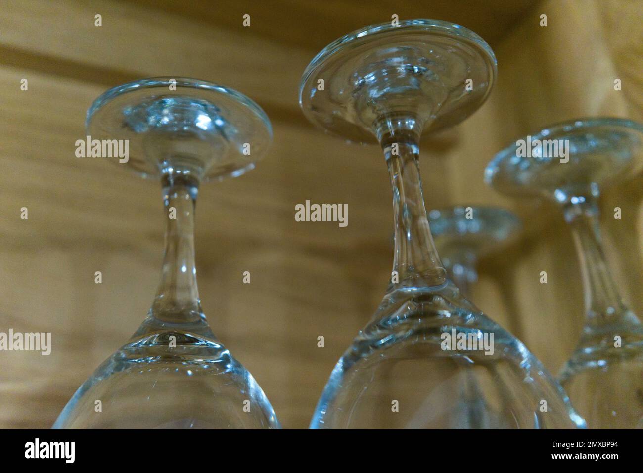 Wine glasses in a handmade Oak wooden cupboard Stock Photo