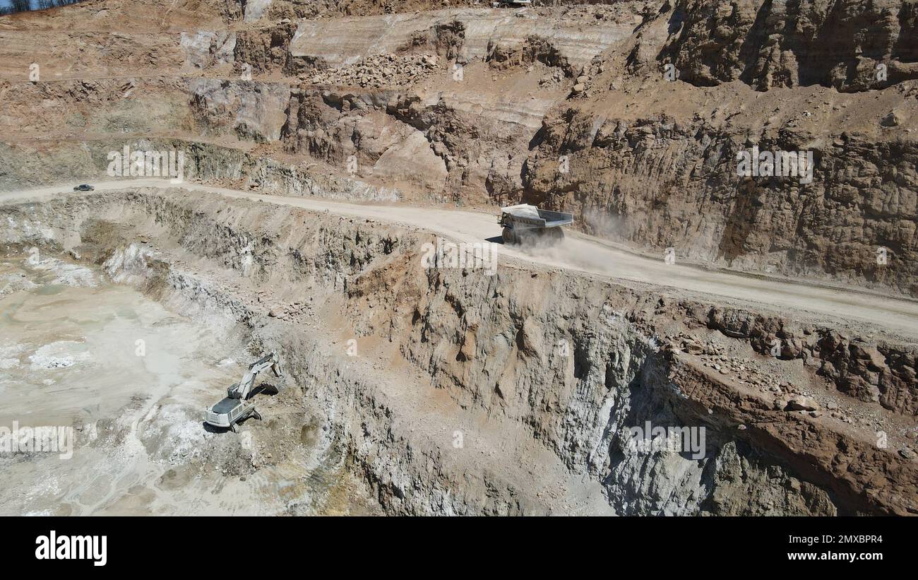 Large quarry dump truck full of stones. Transporting the ore into the