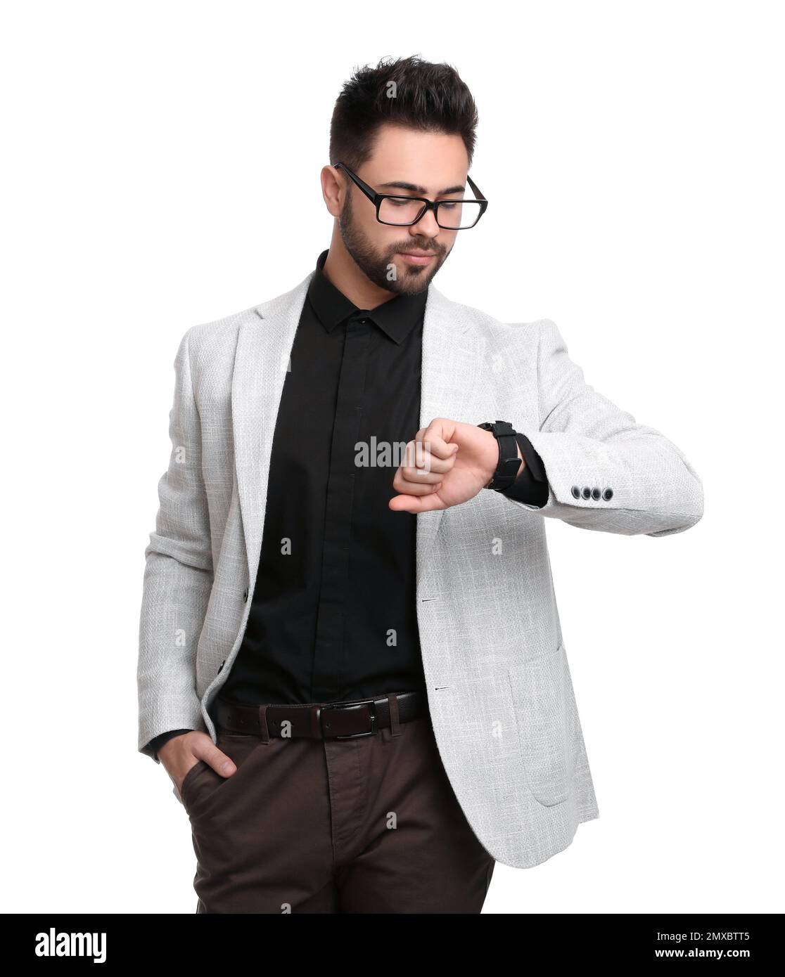 Young businessman checking time on white background Stock Photo - Alamy