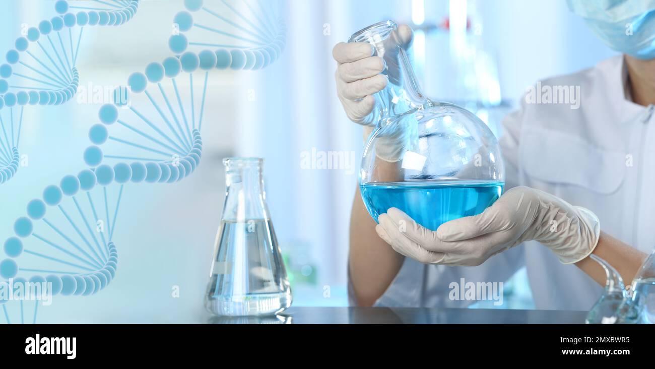 Scientist holding Florence flask with blue liquid for analysis in
