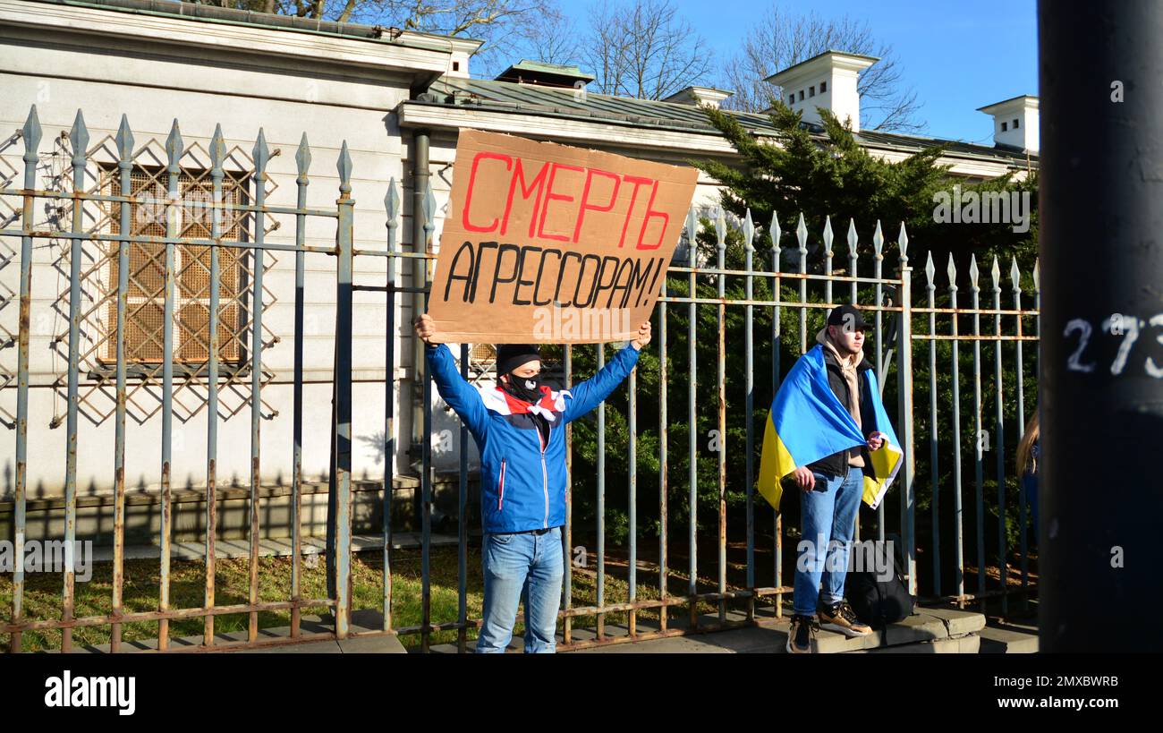 Warsaw, Poland. 24 February 2022. Anti-war protest outside Russian embassy in Warsaw. Demonstrators call for peace and condemn Putin. Stock Photo