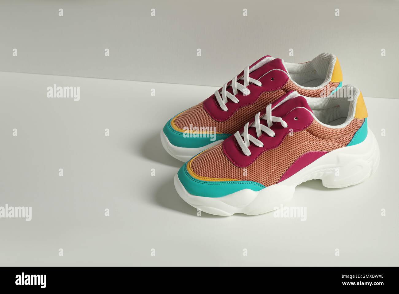 Colorful sneakers in empty drawer. Footwear storage Stock Photo - Alamy