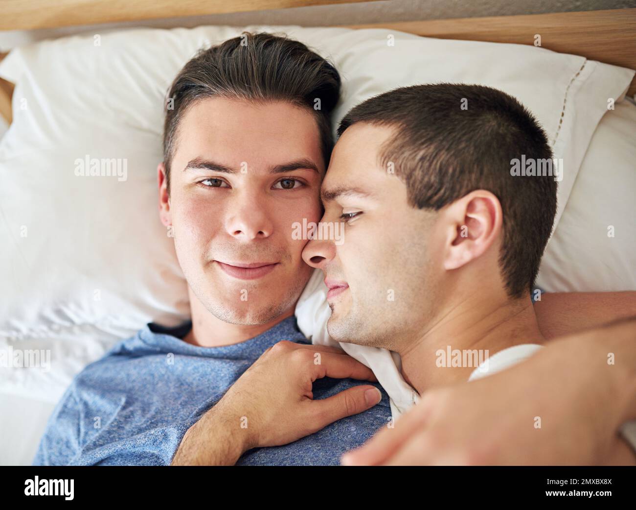 I never want to get up. Portrait of a young gay couple relaxing in bed