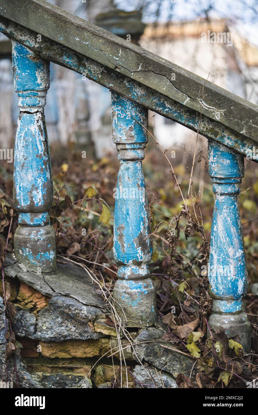 a balustrade on the railing of an old cracked staircase Stock Photo - Alamy