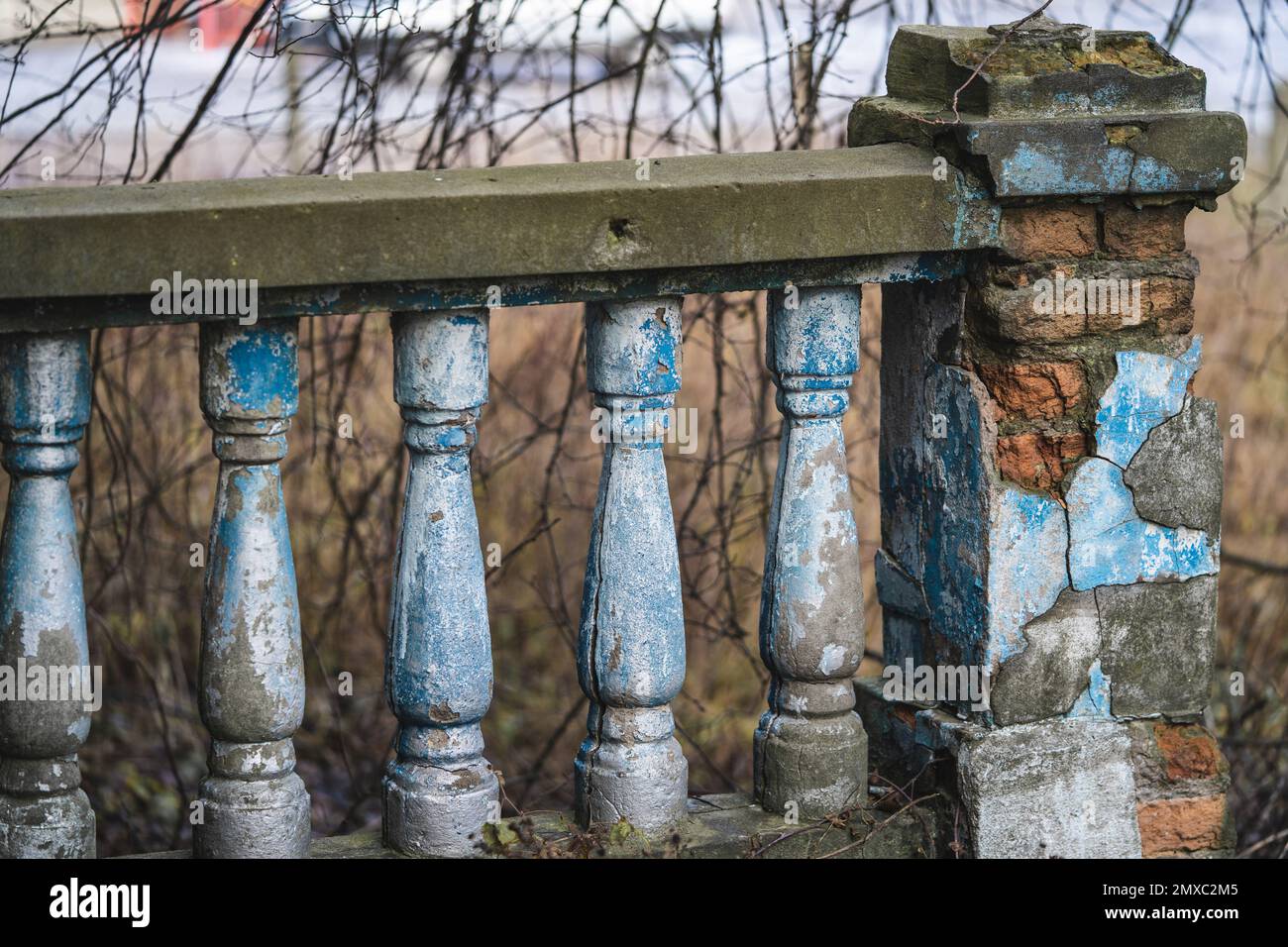 a balustrade on the railing of an old cracked staircase Stock Photo - Alamy