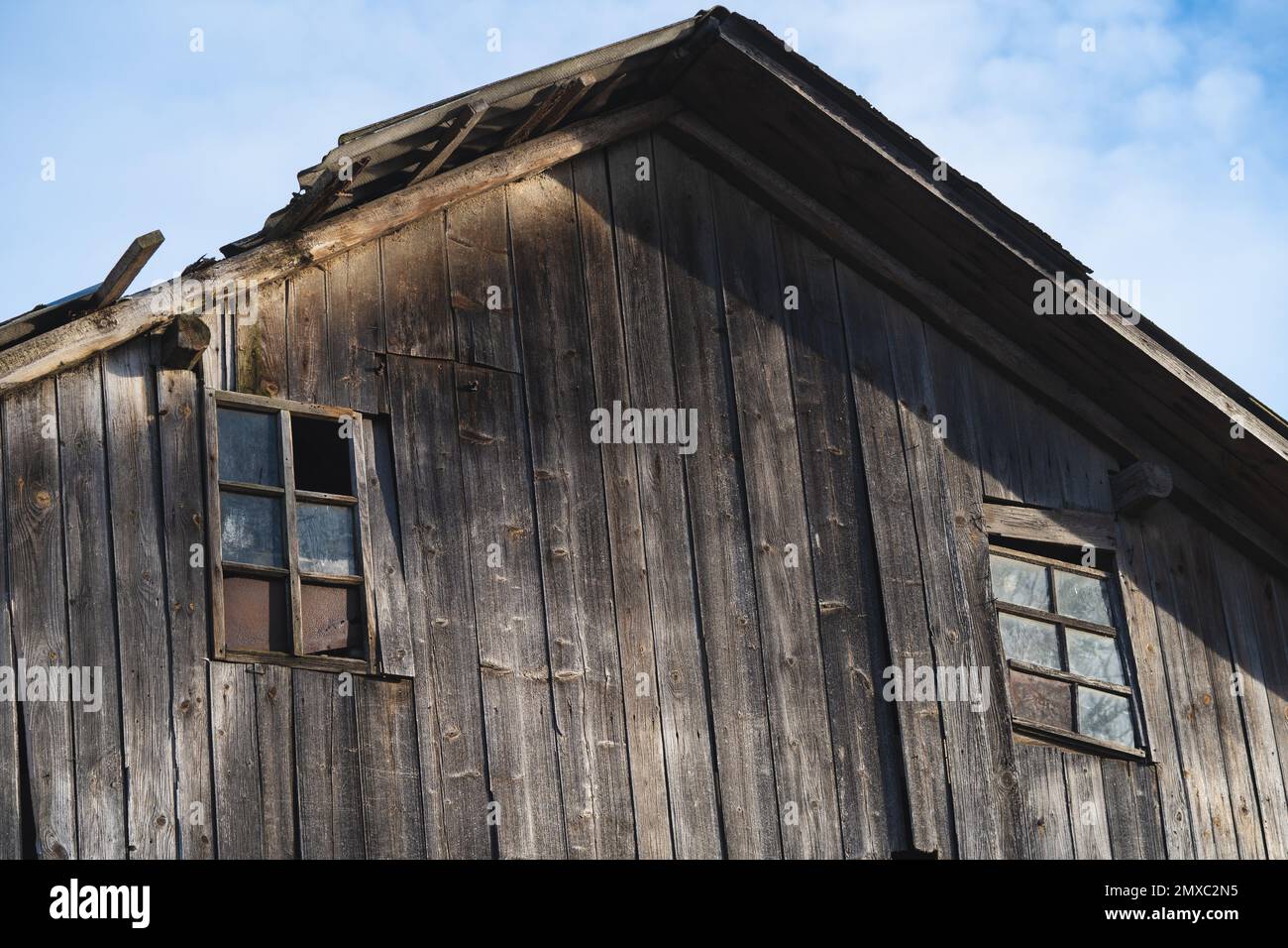 old wooden house with windows high in the sky Stock Photo - Alamy