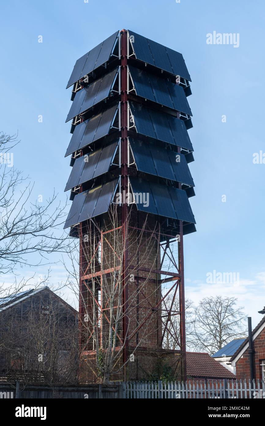 Solar panels on a drill tower at the old army fire station in Bordon, Hampshire, England, UK, now an eco-station Stock Photo