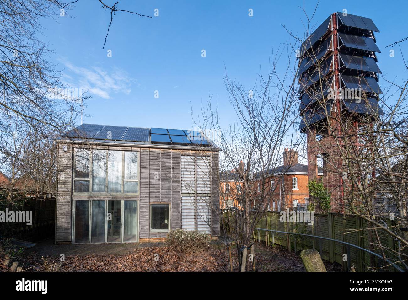 Solar panels on a drill tower at the old army fire station in Bordon, Hampshire, England, UK, now an eco-station, next to an exhibition eco-house Stock Photo