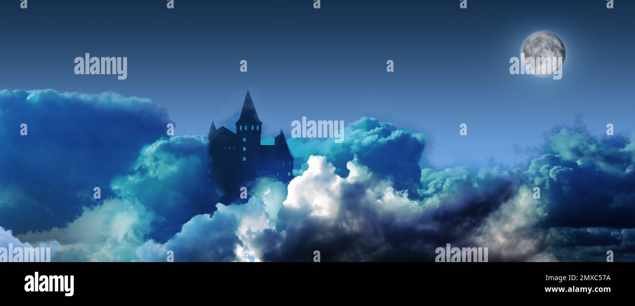 Fairy tale world. Mysterious castle surrounded by clouds under sky with ...