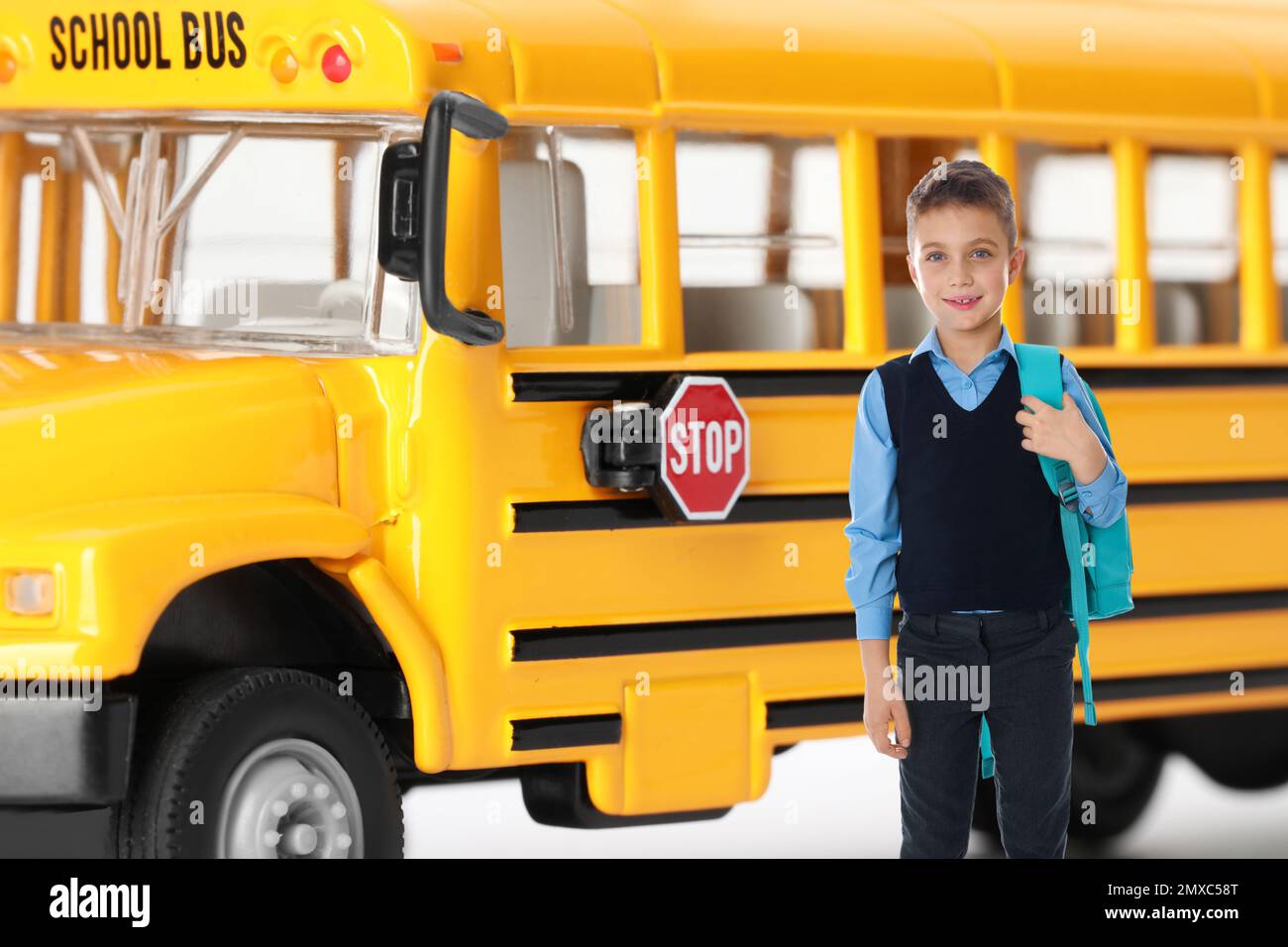 Boy with backpack near yellow school bus. Transport for students Stock ...